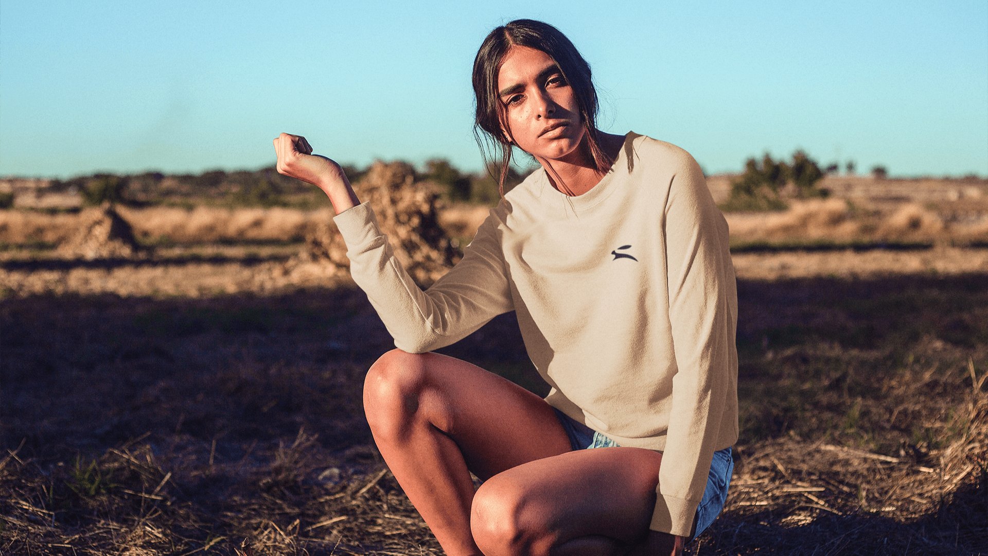 Original Grozavu bunny logo over Barcelona studio scene—premium cotton pieces and eco packaging