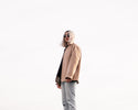 a woman with white hair standing on a skateboard
