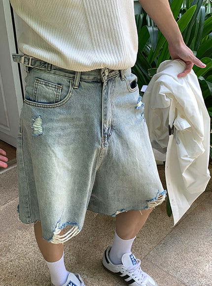Blue washed distressed denim shorts with Grozavu logo
