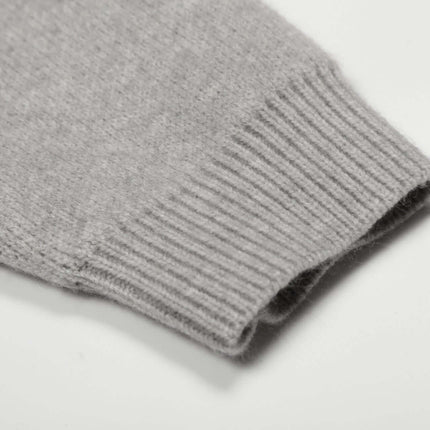 Close-up of the cuff of the Letter Jacquard Knit Hoodie – Loose Fit in soft gray tone.