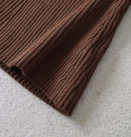 Metal Knot Hollow-Out Flare Sleeve Knit Top fabric detail showcasing ribbed texture and flared sleeve design.