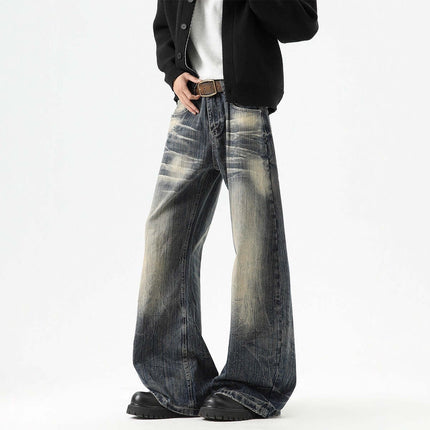 Knife-Edge Denim Trousers – Loose Fit model showcasing unique knife-edged seam detailing and a vintage distressed finish.