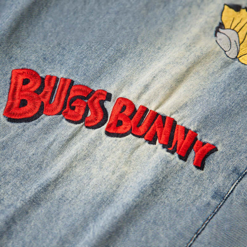 Blue cartoon embroidered washed denim with Grozavu logo