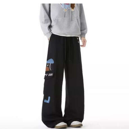 Model wearing Embroidered Dog Sweatpants – Loose Fit with playful dog designs and relaxed fit.