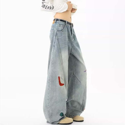 Knife-Cut Embroidered Pants – Loose Fit featuring a unique knife-cut silhouette and bold embroidered accents.