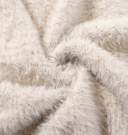 Close-up of soft, beige fabric texture used in the Floral Jacquard Knit Cardigan – Loose Fit.