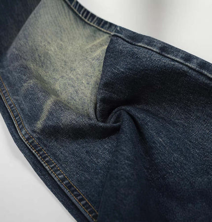 Vintage White Washed Straight Pants close-up detail of the distressed fabric and faded finish.