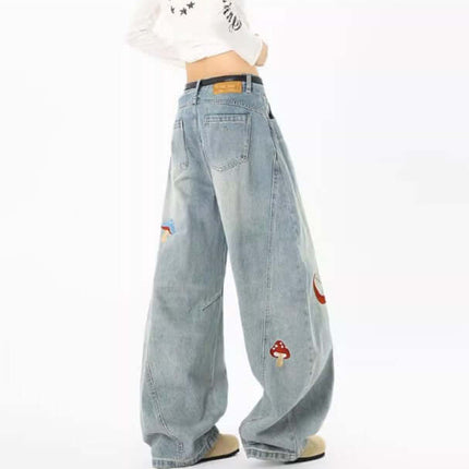 Knife-Cut Embroidered Pants – Loose Fit showcasing deconstructed style and unique embroidery details in washed denim.