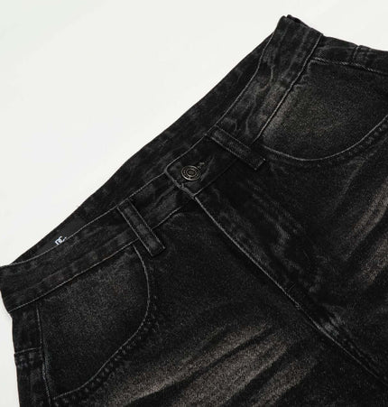 Washed Black Vintage Knife Cut Jeans close-up showing the faded black denim fabric and relaxed fit.