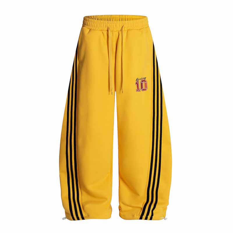 Model wearing Yellow street three stripe embroidered track by Grozavu