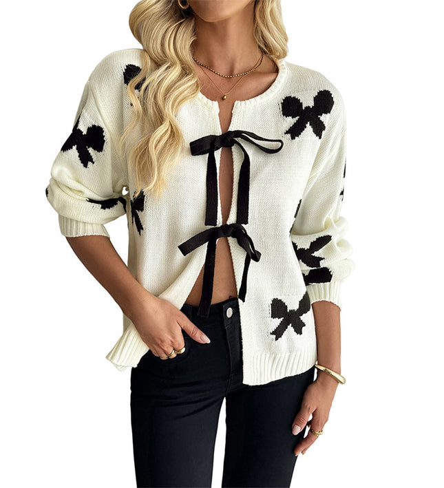 Loose-fit knit sweater with fringe patchwork for cozy comfort and effortless casual style.