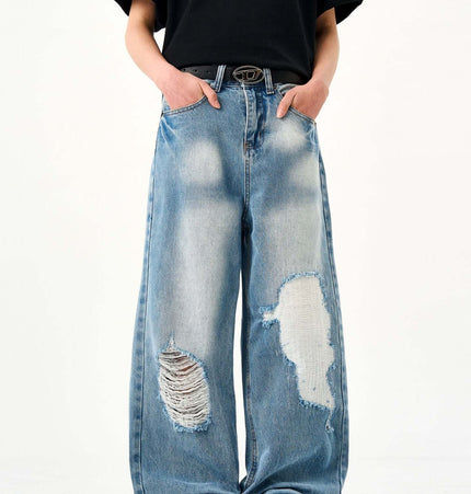 Casual Ripped Light Blue Jeans – Loose Fit showcasing a laid-back, vintage style with ripped detailing.