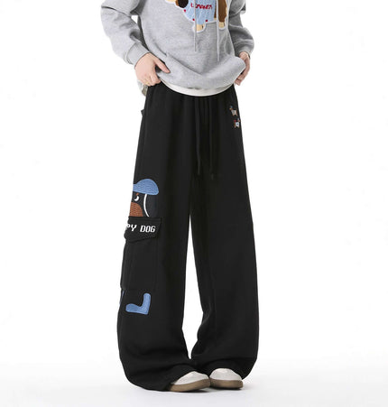 Dog Embroidered Sweatpants - Loose Fit showcasing a relaxed black design with playful dog graphics.