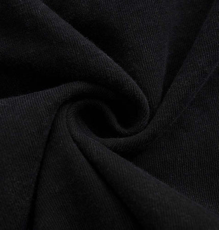 Close-up of soft black fabric showcasing texture, ideal for a Retro Washed Letter TShirt – Loose Fit.