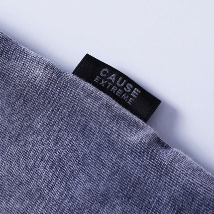 Close-up of the label on the Retro Tie-Dye Spliced T-Shirt – Loose Fit, featuring the words 'CAUSE EXTREME'.