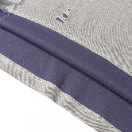 Close-up of the Punk Distressed Short Sleeve T-Shirt – Loose Fit, showcasing distressed fabric and patchwork details.