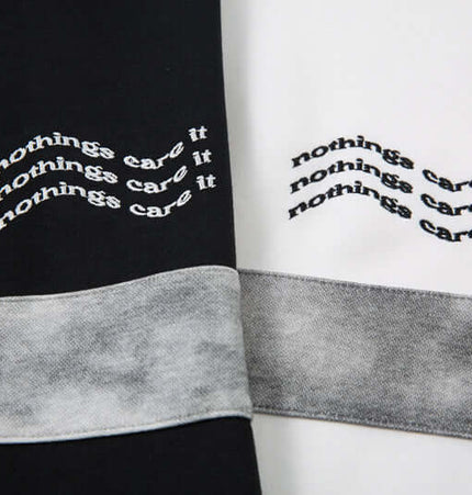Retro Embroidered Patchwork Polo Hoodie featuring unique embroidered text design in black and white fabric.