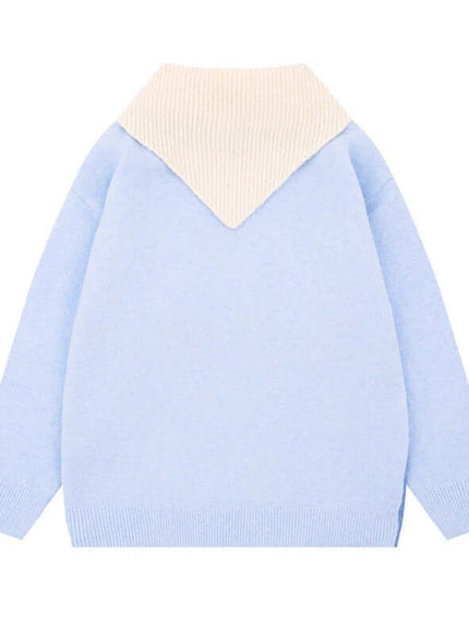 Close-up of Blue cute cat shawl knit top fabric