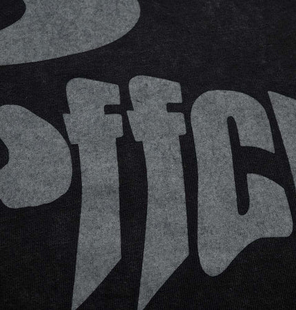 Close-up of the Retro Washed Letter TShirt – Loose Fit showcasing bold letter graphic on vintage-finished fabric.
