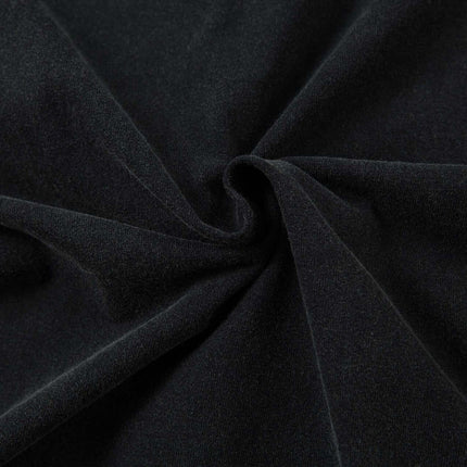 Close-up of soft black fabric showcasing premium texture for Retro Washed Badge Letter T-Shirt – Loose Fit.
