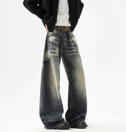 Knife-Edge Denim Trousers – Loose Fit displayed in a casual outfit with unique knife-edged detailing and distressed finish.