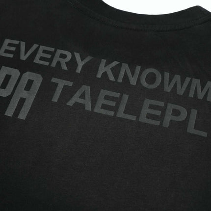 Washed Spray Print T-Shirt – Loose Fit featuring unique spray print typography on a black cotton fabric.