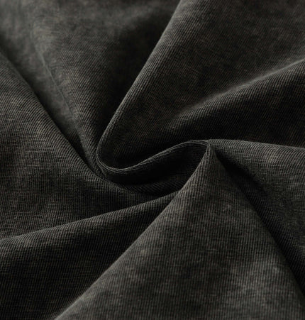 Close-up of soft black fabric showcasing the texture of the Retro Washed Letter TShirt – Loose Fit.