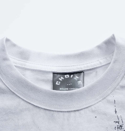 Retro Washed Castle Letter TShirt – Loose Fit close-up showing collar and label detail on a white shirt.
