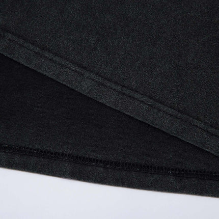 Detail of the hem and fabric of the Retro Washed Badge Letter T-Shirt – Loose Fit, showcasing premium quality.