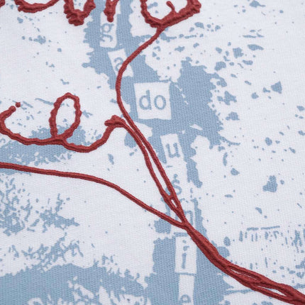 Retro Washed Face Letter T-Shirt – Loose Fit graphic design with red thread on light background