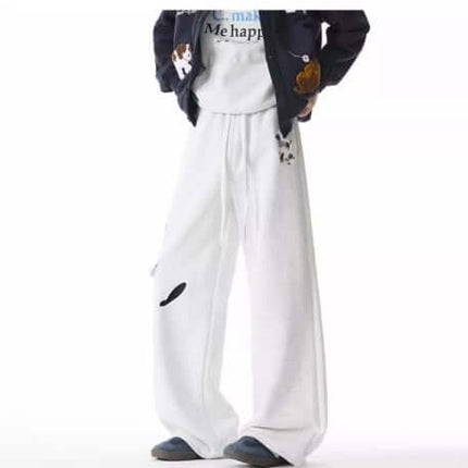 Embroidered Dog Sweatpants – Loose Fit showcased in a relaxed streetwear look with playful dog embroidery details.