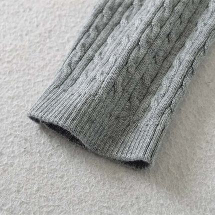 Round Neck Half-Button Knit Sweater close-up of the knit texture and sleeve detail