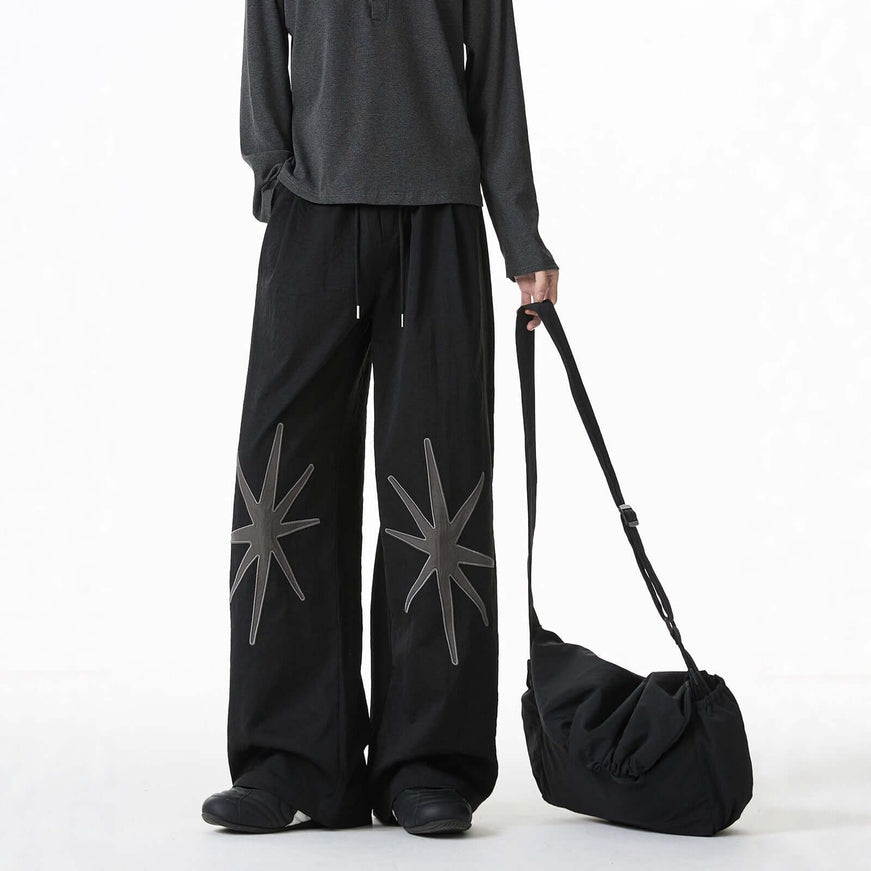 Black patterned technical trousers with Grozavu logo