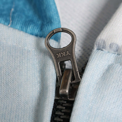 Close-up of zipper detail on Magazine Printed Zip-Up Hoodie – Loose Fit showing premium quality construction.