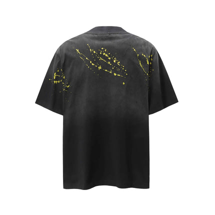 Retro Splatter Print T-Shirt – Loose Fit in black with yellow splatter design on the back, showcasing a relaxed fit.