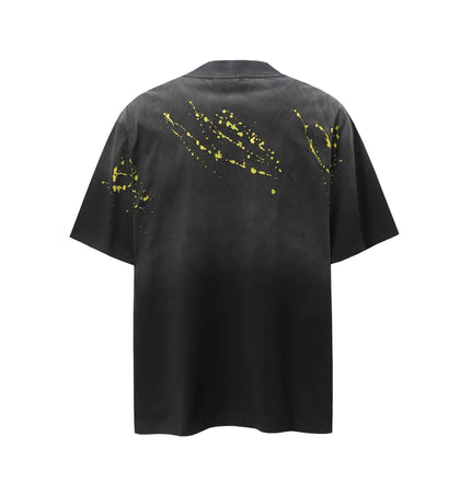 Retro Splatter Print TShirt – Loose Fit featuring a unique faded splatter design on a black background.