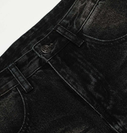 Grozavu Washed Black Vintage Knife Cut Jeans close-up showcasing the mid rise waist and cat whisker fade detail.