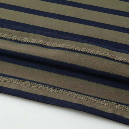 Close-up of the fabric showcasing the stripes of the Striped Lapel Polo Shirt in earthy tones.