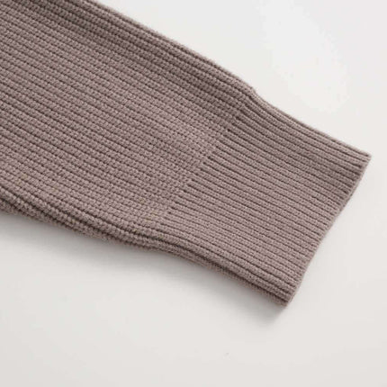 Close-up of the sleeve of the Lazy Streetwear Knit Sweater – Loose Fit showcasing textured knit design.