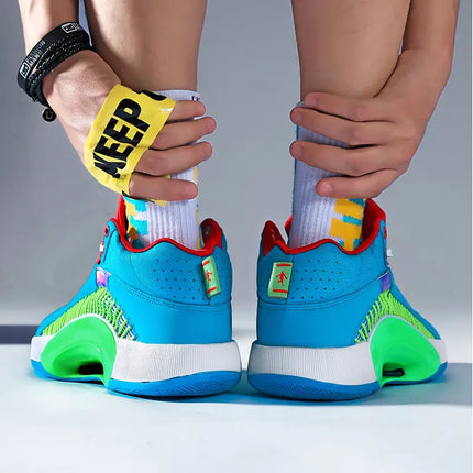 Person wearing vibrant blue and green high-quality men's basketball shoes with cushioned soles, adjusting their socks.