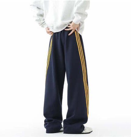 Heavyweight Three-Stripe Pants - Loose Fit featuring loose fit and straight-leg silhouette with bold athletic stripes.