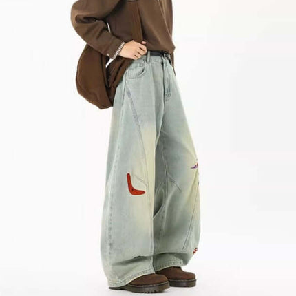 Embroidered Patchwork Denim Pants showcased on a model, featuring a loose fit and playful urban style.