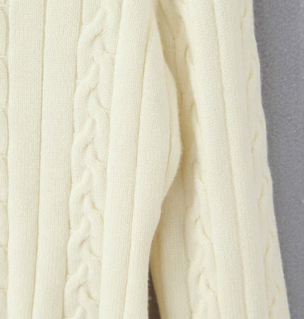 Close-up of the Off-Shoulder Twists Slim Knit Sweater showcasing its texture and cable knit design.