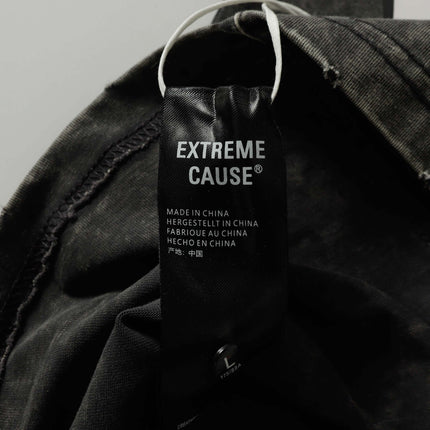Label of the Extreme Cause® Retro Washed Pocket Embroidery T-Shirt – Loose Fit hanging from the garment.