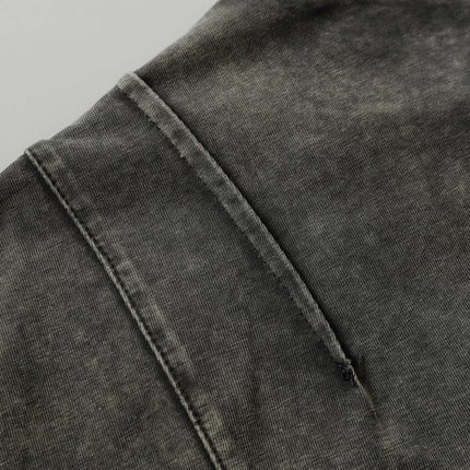 Close-up of the Retro Washed Pocket Embroidery T-Shirt – Loose Fit showcasing its worn texture and pocket detail.