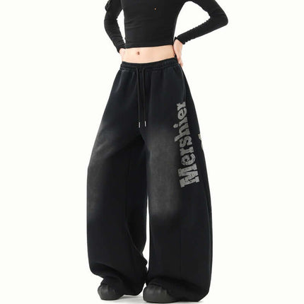 Washed Letter Sweatpants - Loose Fit displayed on model with a cropped top, showcasing their wide-leg style and comfort.