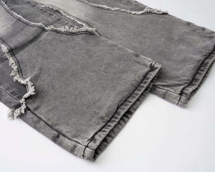 Pantalones de mezclilla retro desgastados con parches y efecto de bigote