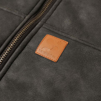 Close-up of the Thick Suede Hooded Jacket – Street Style showcasing the zipper and brand tag detail.