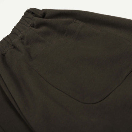 Close-up of the waistband and back pocket of Solid Knife Pants - Loose Fit in dark fabric.