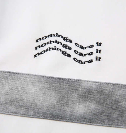 Close-up of embroidered detailing on Retro Embroidered Patchwork Polo Hoodie